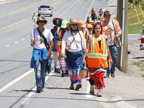 Participants take part in the Enji-TibewÕeseng Nibi Nikwejiwong, an Anishinaabe ceremonial Water Walk for Junction Creek, in Greater Sudbury, Ont. on Wednesday June 16, 2021. Water Walker and conductor of the walk, Tasha Beeds, is leading walkers on a 135 kilometre journey to Spanish where a private ceremony will be held. Participants, who are walking for the water, began their journey in Garson. John Lappa/Sudbury Star/Postmedia Network