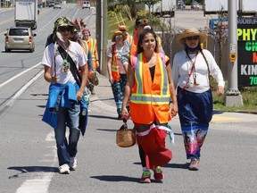 Participants take part in the Enji-Tibew'eseng Nibi Nikwejiwong, an Anishinaabe ceremonial Water Walk for Junction Creek, in Greater Sudbury, Ont. on Wednesday June 16, 2021. Water Walker and conductor of the walk, Tasha Beeds, is leading walkers on a 135 kilometre journey to Spanish where a private ceremony will be held. Participants, who are walking for the water, began their journey in Garson. John Lappa/Sudbury Star/Postmedia Network