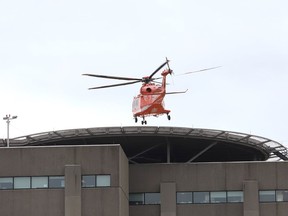 A helicopter lands at Health Sciences North.