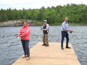 Susan Murray, left, and her siblings, Bob Slade and Fred Slade were on hand for the opening of the Gord Slade Memorial Fishing Outpost at Crowley Lake in Sudbury, Ont. on Thursday June 24, 2021. John Lappa/Sudbury Star/Postmedia Network