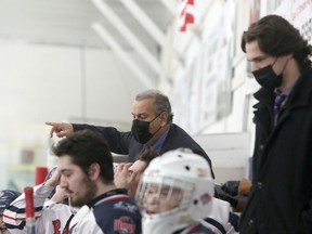 French River Rapids head coach Paul Frustaglio speaks to his players during first-period NOJHL action against the Espanola Express at Noelville Community Centre. Postmedia Network