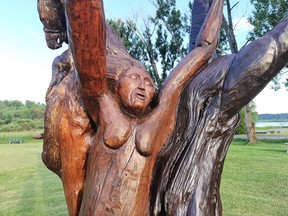 Stacy Sauve carved figures into a white willow tree in honour of all the children who attended the Spanish Indian Residential Schools.