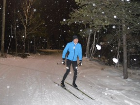 Francois Caron skis on an illuminated trail at Laurentian University in 2019. The lights were installed by the Laurentian Nordic Ski Club in memory of Robert D'Aloisio.