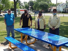 The Sarnia Lions Club is collecting empty bottles and cans to support initiatives such as maintaining and improving Russell Street's Lions Park. From left to right: Sarnia Lions Club members Dave Bricker, Treasurer Ken Cryderman, Lyn Sparling and President Ron Armstrong. Carl Hnatyshyn/Sarnia This Week