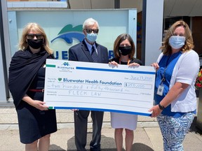Fleck Law's Pascale Daigneault and Carl Fleck present a $250,000 cheque to Bluewater Health Foundation executive director Kathy Alexander and Bluewater Health's director of diagnostic services Debbie Croteau, in support of the redevelopment of the hospital's laboratory. Handout/Sarnia This Week