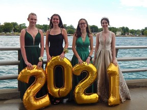 Recent St. Patrick's Catholic High School graduates (from left to right) Emma Thompson, Abby Vrolyk, Ryan MacKay and Jessica Laucke – along with scores of fellow graduates and family members – posed for pictures under the Bluewater Bridge on June 19. Carl Hnatyshyn/Sarnia This Week