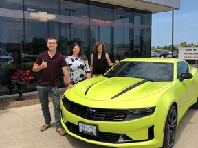 Rebound Win A Car raffle winner Aaron Ellenor (left) accepts keys to his new 2021 Chevrolet Camaro from MacFarlane Chevrolet Buick GMC general manager Kristin MacFarlane (center) and Rebound fund development co-ordinator Anita Minielly (right). Handout/Sarnia This Week