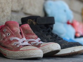 Community members brought shoes and toys to Hollinger Park to honour 215 children whose remains were found in an unmarked grave at the former residential school in Kamloops, B.C.

Dariya Baiguzhiyeva/Local Journalism Initiative