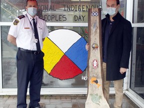 On the occasion of National Indigenous Peoples Day, Timmins native Brent Gauthier presented an artwork piece he created to the Timmins Police Service. The piece represents the history of Indigenous people in Timmins. Timmins Police Deputy Chief Henry Dacosta, left, accepted the artwork from Gauthier on Monday morning outside the police station. The artwork will be on display at the station as a symbol of community unity among various Timmins agencies and the local Indigenous population.

RICHA BHOSALE/The Daily Press