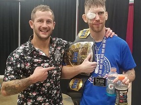 Timmins mixed martial artist Terry 'Good Time' Lemaire, left, congratulates Jeremy 'Pony Boy' Pender, following their bout on Saturday in Dayton, Ohio. Pender retained his bantamweight title, defeating Lemaire with a knockout in the third round.

Supplied/B2 Fighting