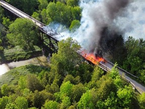 A drone photo of the Willow Creek trestle bridge near Paisley, Ontario, as it burned Saturday, June 5, 2021.