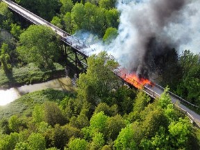 A drone photo of the Willow Creek trestle bridge near Paisley, Ontario, as it burns on Saturday, June 5, 2021.