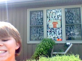 Carson Meharg, 10, from Tillsonburg, stands in front of a memorial he and his mother Jane Sage made for 215 residential school children. (Submitted)