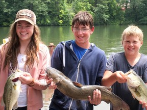 Nicole, Hendrik and Brandon VanBrenk hold up some of the fish they caught during the 2019 Tillsonburg Family Fishing Derby at Lake Lisgar. Hendrik's 29-inch catfish was the biggest fish of the day. This year's July 3-11 derby will be a virtual event. Participants will be emailing photos of themselves fishing or holding fish, or doing outdoor activities as a family at the lake. (Chris Abbott/File Photo)