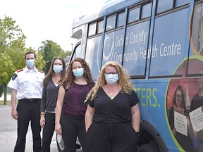 The Oxford County Community Health Centre will be launching a mobile health outreach bus this fall. Shown is the team working on the bus: Outreach worker Amanda Cook, nurse practitioner Jennifer Stock, nurse Sarah Irwin and paramedic Ryan Orton. Kathleen Saylors/Postmedia Network