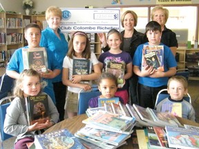 CLUB DONATION-Ten years ago, the Richelieu Club donated $1,250 to École catholique Nouveau Regard to help purchase books for the school library. The books vary from those for early readers to those for advanced ones, which complements the reading program already in place at the school, and helps students move up reading levels more easily. Pictured in back (from left) are Richelieu Club president Lucille Narbonne, Principal Laplante-Hardy, and Richelieu Club member Diane Ayotte; and in front (from left) Arianne Génier, Noëlla Ilunga, Réjean Ouellet, Dominic Beaudoin, Danika Beaulne, Sabrina Mercier and Casey Groulx. 
.TP.jpg