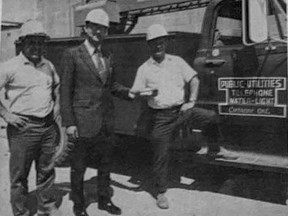 GETTING TO KNOW YOU- Ray Slavickas, newly appointed engineer-manager of the Public Utilities Commission talks power with Peter Thivierge (left) electrician and Hank Osmar (right) electrical services. .TP.jpg