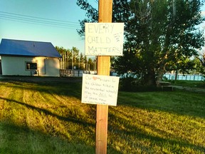 In remembrance of the 215 children found buried near the Kamloops residential school, Champion resident Meagan Jeffrey and her three teenage boys recently made a sign and placed flowers and teddy bears in an empty lot near the village's school and campground.