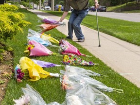 Richard Clarke of London, who lives with multiple sclerosis, walked to the front of the London Muslim Mosque on Tuesday to lay down flowers "from our family to theirs."