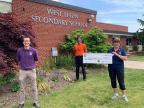 President Joan Neil (right) of the Optimist Club of West Lorne presents a cheque to West Elgin Secondary School to celebrate this year's graduates. Representing WESS Dave Burke, guidance counsellor (left) and Jim Copeland, principal (middle). Handout