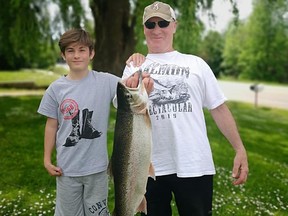 Gary Fischer and grandson Luc Gooding pose with the big-money winning 11.57-pound rainbow trout that earned $1,750 at the first-annual Lures N Lines Spring Trout Derby. The derby raised $5,000 for the Bruce Peninsula Sportsmen Association. Photo supplied.