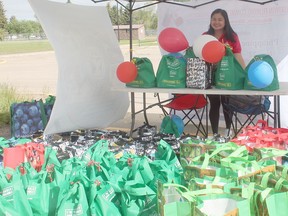 Raizza Ann Tolsa prepares for the opening of the Community Pantry during the Wetaskiwin Filipino Community Foundation's 123rd Independence Day celebrations June 12.