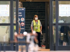 A navigator waits to direct people coming to the COVID-19 vaccination site at RBC Convention Centre in Winnipeg on Wed., June 2, 2021. KEVIN KING/Winnipeg Sun/Postmedia Network