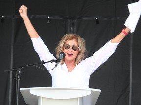 Judith Morris, shown here celebrating Lambton College's recent graduation event, retired this week as president of the Sarnia school.

Paul Morden/The Observer