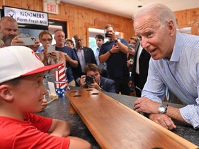 US President Joe Biden speaks with people before getting ice cream at Moomers Homemade Ice Cream in Traverse City, Michigan on July 3, 2021. (Photo by MANDEL NGAN / AFP) (Photo by MANDEL NGAN/AFP via Getty Images)