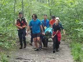 A group of hikers and park wardens were among those who helped rescue an individual overcome by dehydration and heat exhaustion at Killarney Provincial Park. OPP photo