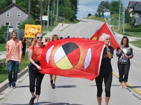 Roughly 50 or so people walked peacefully from the Walkerton Community Centre to the Tim Horton’s on McNab Street on July 1 – Canada Day. The walk was held for the Indigenous community in response to the recent findings of unmarked graves at residential schools in Canada. KEITH DEMPSEY
