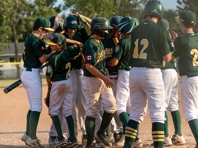 Ronan Johnson is mobbed by his teammates after a home run versus the Camrose Cougars in U-13 AAA play during the Doc Plotsky Memorial Tournament. Photo courtesy Kris Kushnerick
