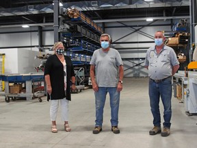 Doug Chamberlain, centre, will mark his 50th anniversary with Northland Glass and Metal Monday. He is flanked by senior project manager Vicky Bakker, left, and Peter Lagassie. Michael Lee/The Nugget