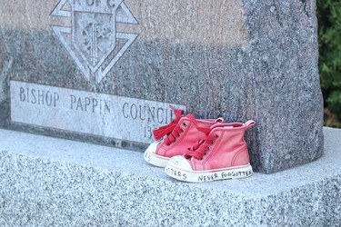 A child's shoes dedicated to graves found at Kamloops Indian Residential School at Our Lady of Good Counsel Catholic Church on Saturday, July 10, 2021 in Sault Ste. Marie, Ont. (BRIAN KELLY/THE SAULT STAR/POSTMEDIA NETWORK)