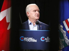 Conservative Leader Erin O'Toole reads from a teleprompter as he makes an announcement in Calgary on Thursday, July 8. JEFF MCINTOSH/The Canadian Press