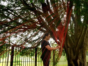 Métis artist Tracey-Mae Chambers installs her exhibit, Hope and Healing, outside Gallery Stratford Monday morning. (Galen Simmons/The Beacon Herald)