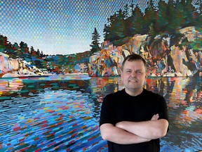 Artist Frank Danielson poses in front of his large canvas Killarney. The Sudbury painter will have new artwork featured at Perivale Gallery on Manitoulin Island beginning this Saturday.