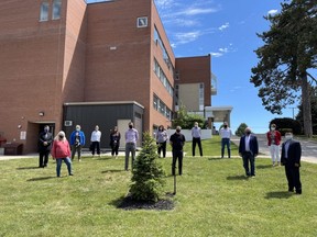 A red spruce tree was planted in memoriam for Bruce Quigley, the former CEO of AMGH who passed away recently. (L-R): David Mackechnie, Kathleen Babcock, Kimberley Payne, Sherry Marshall, Peggy Byrne Carter, Shawn Lynn, Samantha Marsh, Allan Ball, Mike Niglas, Peter Baker, Glen McNeil, Carolynne Champagne, and Jimmy Trieu who was recently appointed as the new CEO of AMGH. Kathleen Smith
