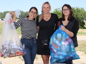 Team members (l-r) Christina Marinelli, Edie Couture and Jazmine Davis are collecting bottles and cans at the Original Joe’s parking lot in a fundraiser for residents of Lytton, B.C.