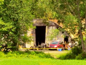 Fire badly damaged this Quonset hut and its contents on Highway 24 East south-west of Simcoe Tuesday evening. Police were monitoring the scene Wednesday while investigators probe the cause. – Monte Sonnenberg