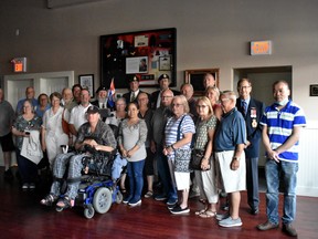 Devon veteran Glen Falardeau (front, centre) with his invited guests at the memorabilia unveiling on Tuesday, July 13 at the Legion hall. (Emily Jansen)