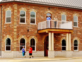 The $2.8-million office-apartment complex at the corner of Talbot Street South and Robinson Street in Simcoe features a vintage, second-storey portico anchored on the sidewalk. The Renaissance building is the creation of the father-son development team of Ken van der Laan, up top right, and Kevin van der Laan, both of Dundas. – Monte Sonnenberg