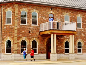 The $2.8-million office-apartment complex at the corner of Talbot Street South and Robinson Street in Simcoe features a vintage, second-storey portico anchored on the sidewalk. The Renaissance building is the creation of the father-son development team of Ken van der Laan, up top right, and Kevin van der Laan, both of Dundas. – Monte Sonnenberg