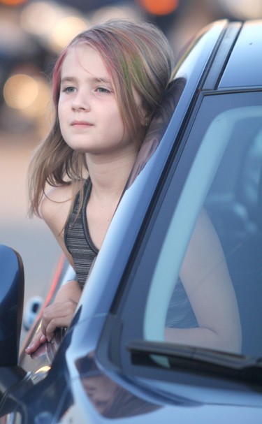 Machines Dream plays at Rotaryfest at the former Lowe's parking lot on Thursday, July 15, 2021 in Sault Ste. Marie, Ont. Breanna Perrin watches from a car. (BRIAN KELLY/THE SAULT STAR/POSTMEDIA NETWORK)