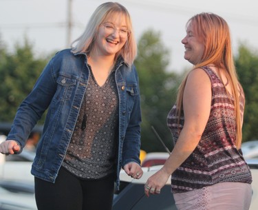 Alandra Brooks and her mother Sharilyn Van Scoy enjoy Mustang Heart at Rotaryfest on Friday, July 16, 2021 in Sault Ste. Marie, Ont. (BRIAN KELLY/THE SAULT STAR/POSTMEDIA NETWORK)