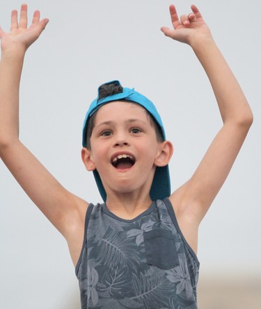 Easton Lethbridge, 8, attending his first concert, enjoys Obsession at Rotaryfest on Saturday, July 18, 2021 in Sault Ste. Marie, Ont. (BRIAN KELLY/THE SAULT STAR/POSTMEDIA NETWORK)