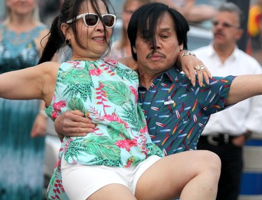 Thiquy Nguyen and her husband Sonny Nguyen dance to Obsession at Rotaryfest on Saturday, July 18, 2021 in Sault Ste. Marie, Ont. (BRIAN KELLY/THE SAULT STAR/POSTMEDIA NETWORK)
