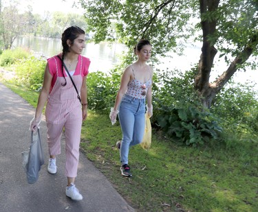 Samara Alani and Alexandra Graves help clean up the St. Mary's River shoreline as part of Freshwater Wise and Blue Mar 4 Change's Water Wise Cleanup as part of the Great Canadian Shoreline Cleanup at Bellevue Park on Saturday, July 17, 2021 in Sault Ste. Marie, Ont. (BRIAN KELLY/THE SAULT STAR/POSTMEDIA NETWORK)