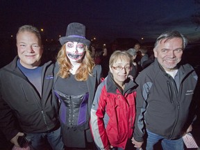 Mayor Peter Brown, Denisa Sanness, executive director of BGC Airdrie club, Sharon Burley and alderman Fred Burley pose for a photo at the VIP sneak peak of the AIRscares haunted house put on by The Boys and Girls Club of Airdrie at 905 Edmonton Trail on Oct. 16, 2014.