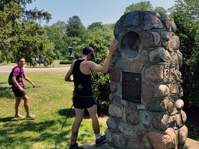 Kip Arlidge touches the rock cairn near Niagara Falls to mark the end of his 890-kilometre trek along the Bruce Trail.  He completed the journey in just more than nine days, establishing a new record for the Bruce Trail in ultra marathon running.
Michael Styba Photo